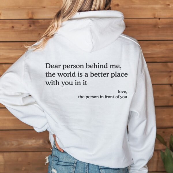 Woman wearing a white Dear Person Behind Me hoodie with the inspirational print on the back.